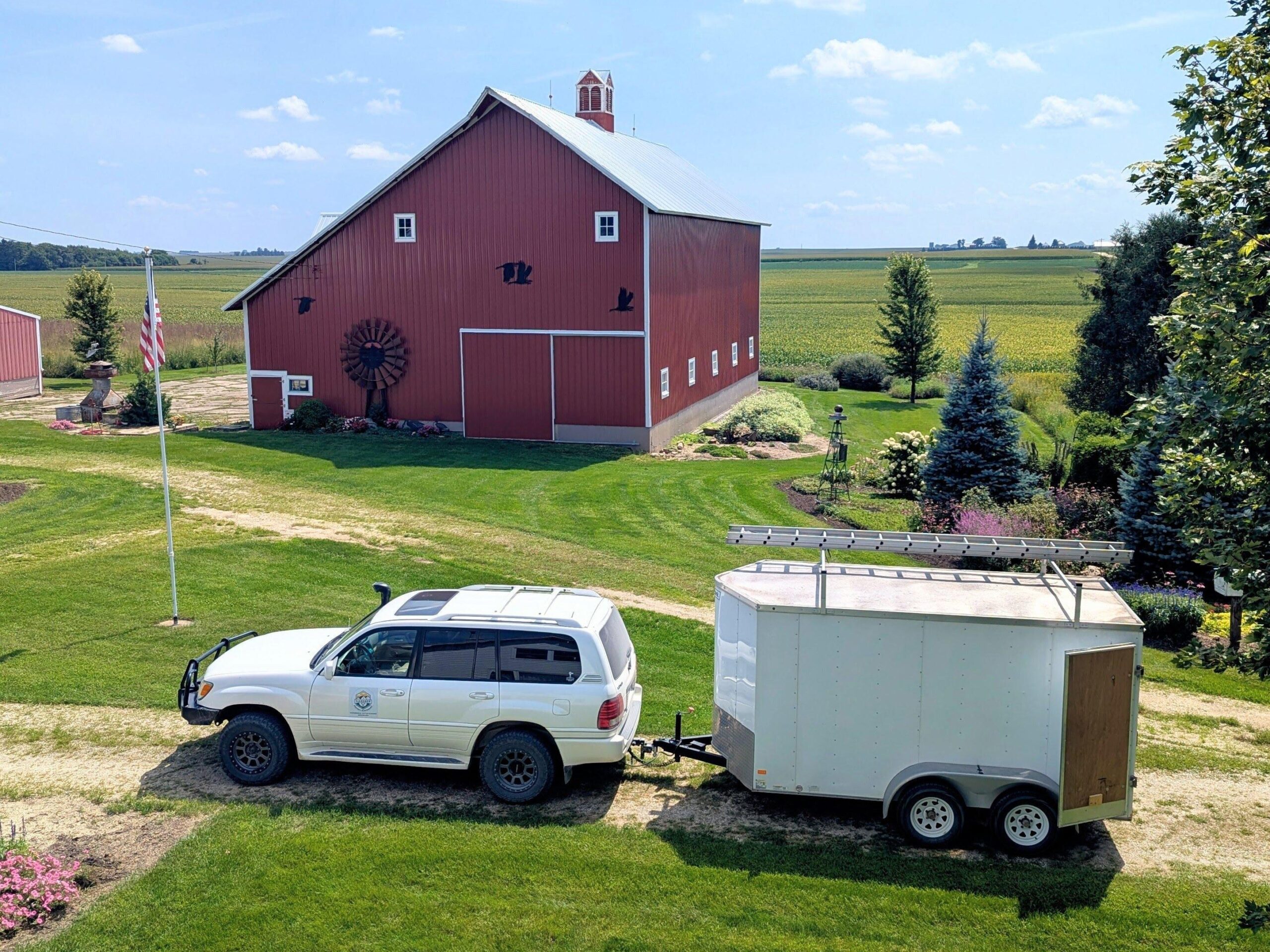 Gardner Property Maintenance truck and trailer at a customer's property